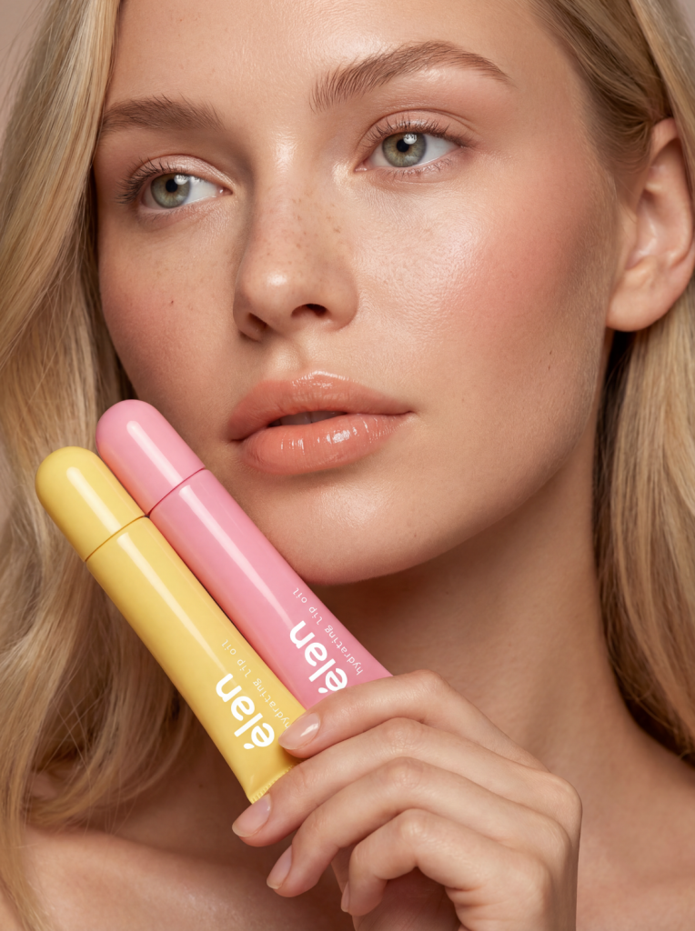 model holding élan yellow and pink lip oil tubes