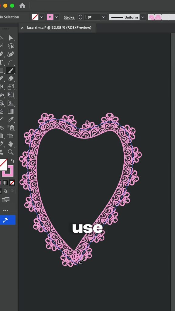 A heart shaped path with the pink lace pattern brush applied on a dark artboard